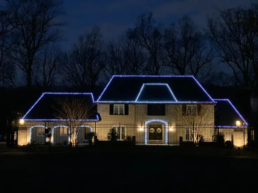 Christmas light installation in the DMV by Light DMV — cool white roofline on an estate home
