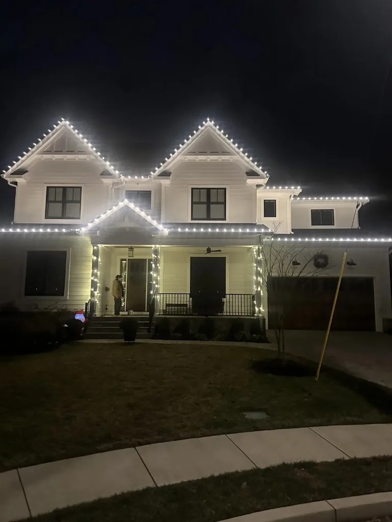 Christmas light installation in the DMV by Light DMV — bright warm white roofline lighting