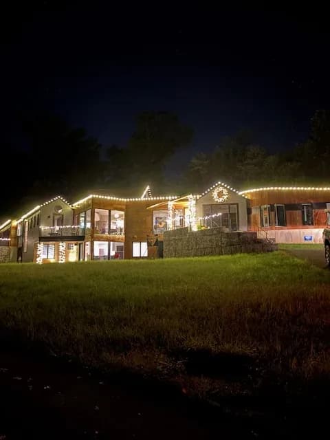 Christmas light installation in the DMV by Light DMV — warm white roofline and landscape accents