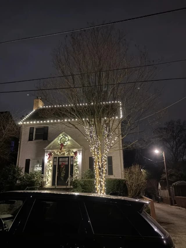Christmas light installation in the DMV by Light DMV — warm white install with front-yard decor