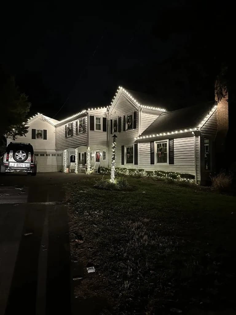 Christmas light installation in the DMV by Light DMV — warm white roofline on a suburban home at night