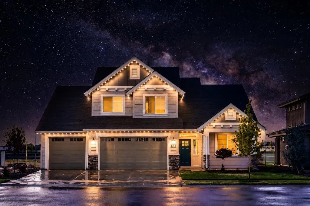 Warm White permanent roofline lighting on a home in Ashburn at night — Light DMV