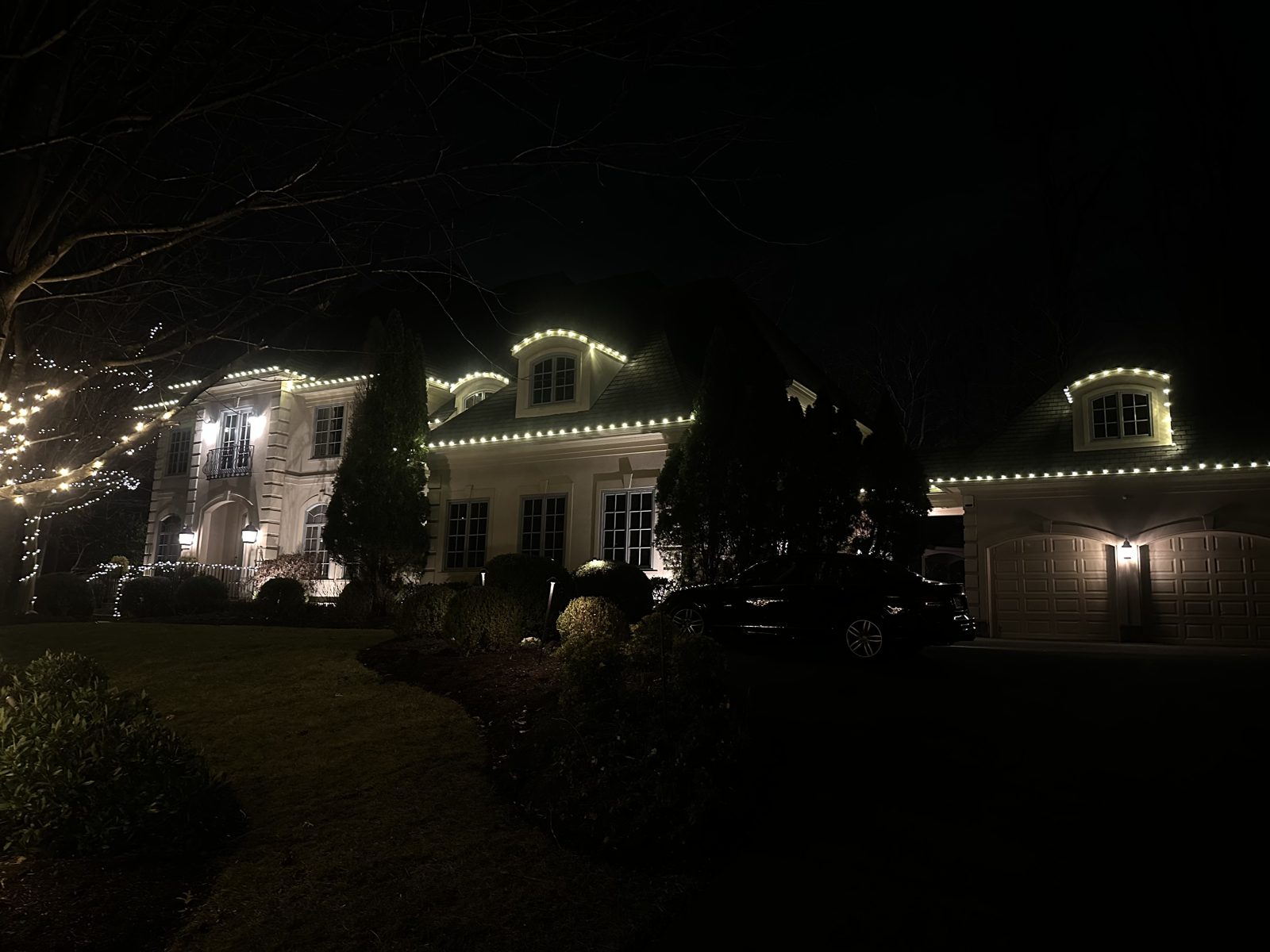 Professional holiday lighting on a DMV home by Light DMV, warm-white roofline display