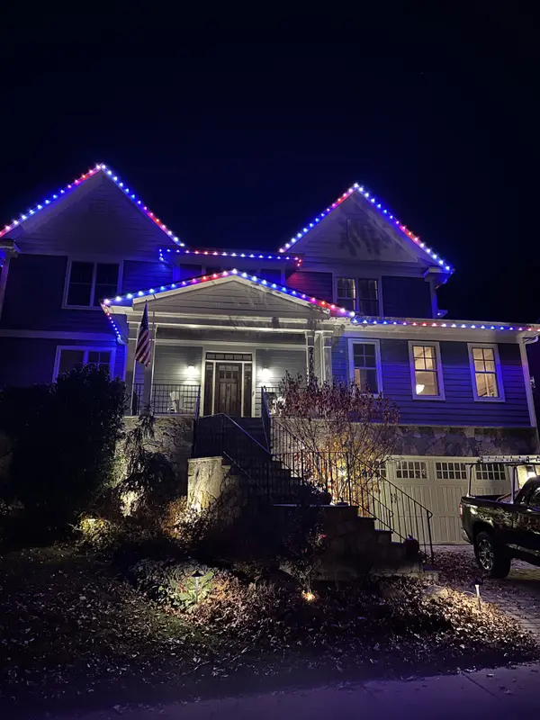 Permanent LED roofline lighting in Leesburg, VA by Light DMV — architectural trim at night