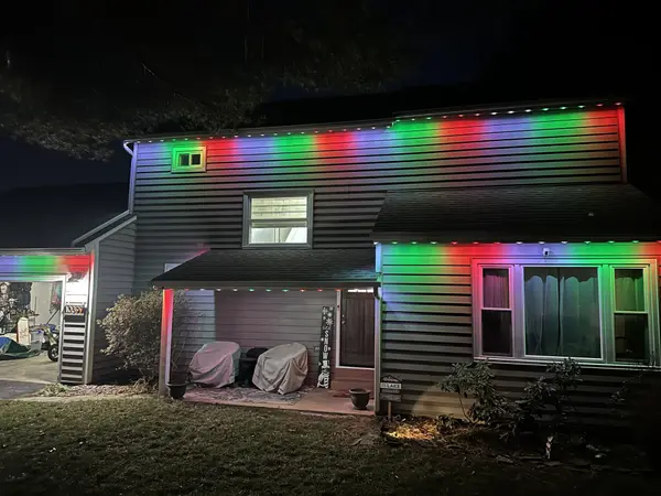 Permanent LED roofline lighting in Leesburg, VA by Light DMV — evening warm-white accent